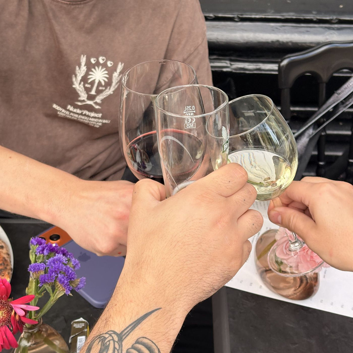 Guests raising a glass of wine at Mangia